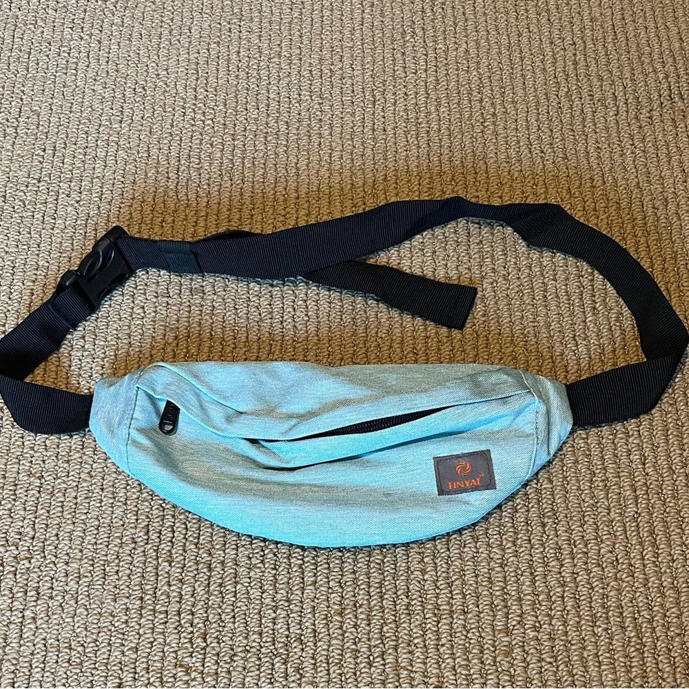 Tinyat brand, light blue fanny pack.